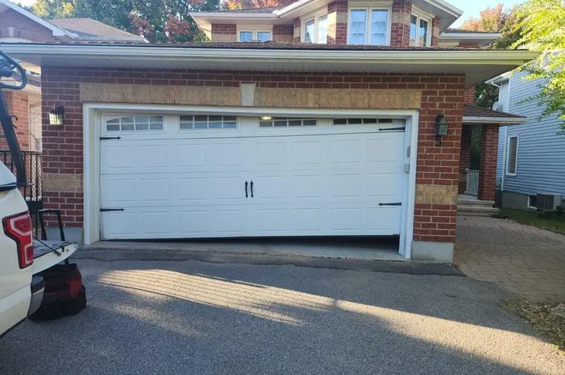 DPS Garage Doors emergency repair of an off-track jammed double garage door in the GTA