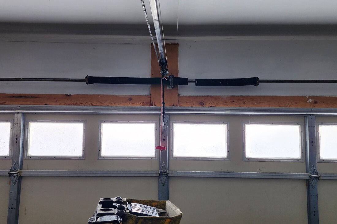 DPS Garage Doors newly installed dual torsion springs on a garage door in the GTA