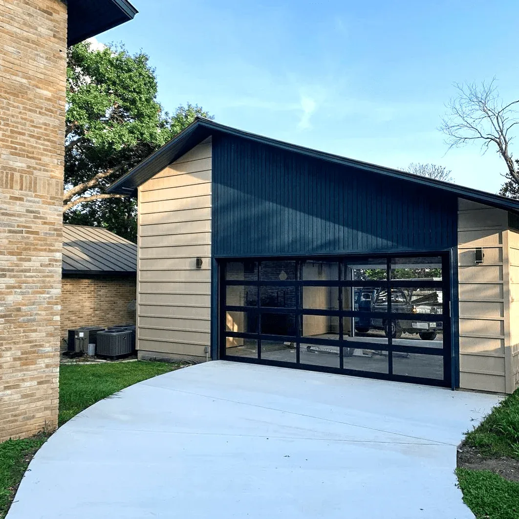 Contemporary aluminum and glass full-view garage door on a modern GTA home