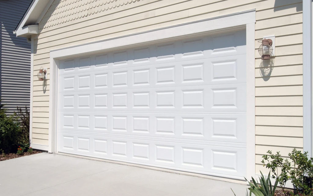 Classic short raised-panel insulated garage door on a GTA home